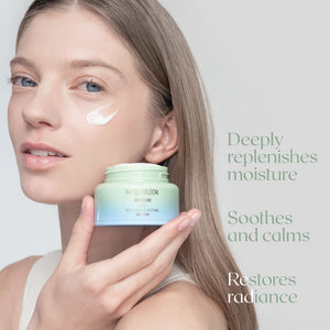 Woman applying hydrating face cream by NATURABLOOM for moisturised, radiant skin”
