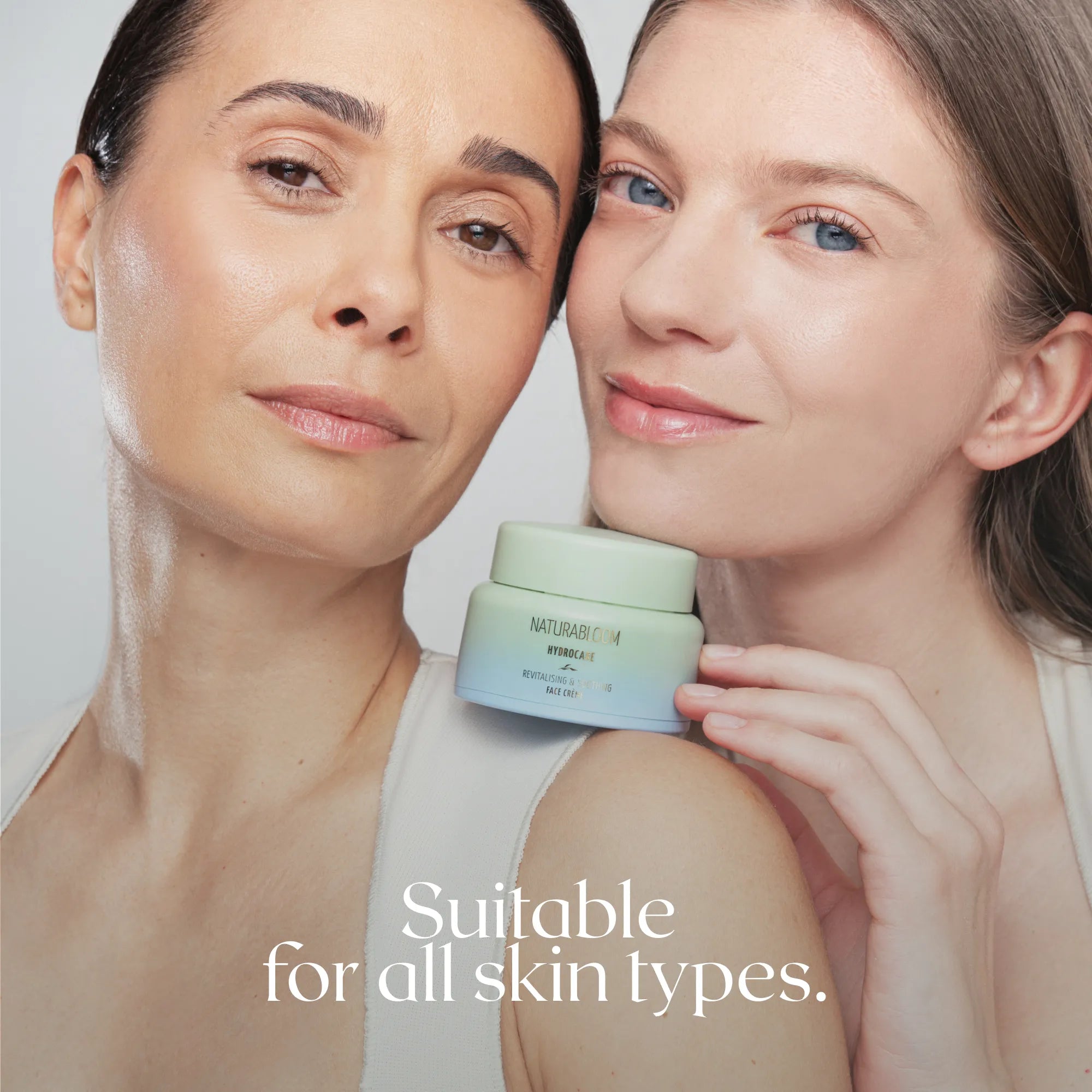 Two women with different skin types holding NATURABLOOM Hydrocare face cream for hydrated, healthy skin